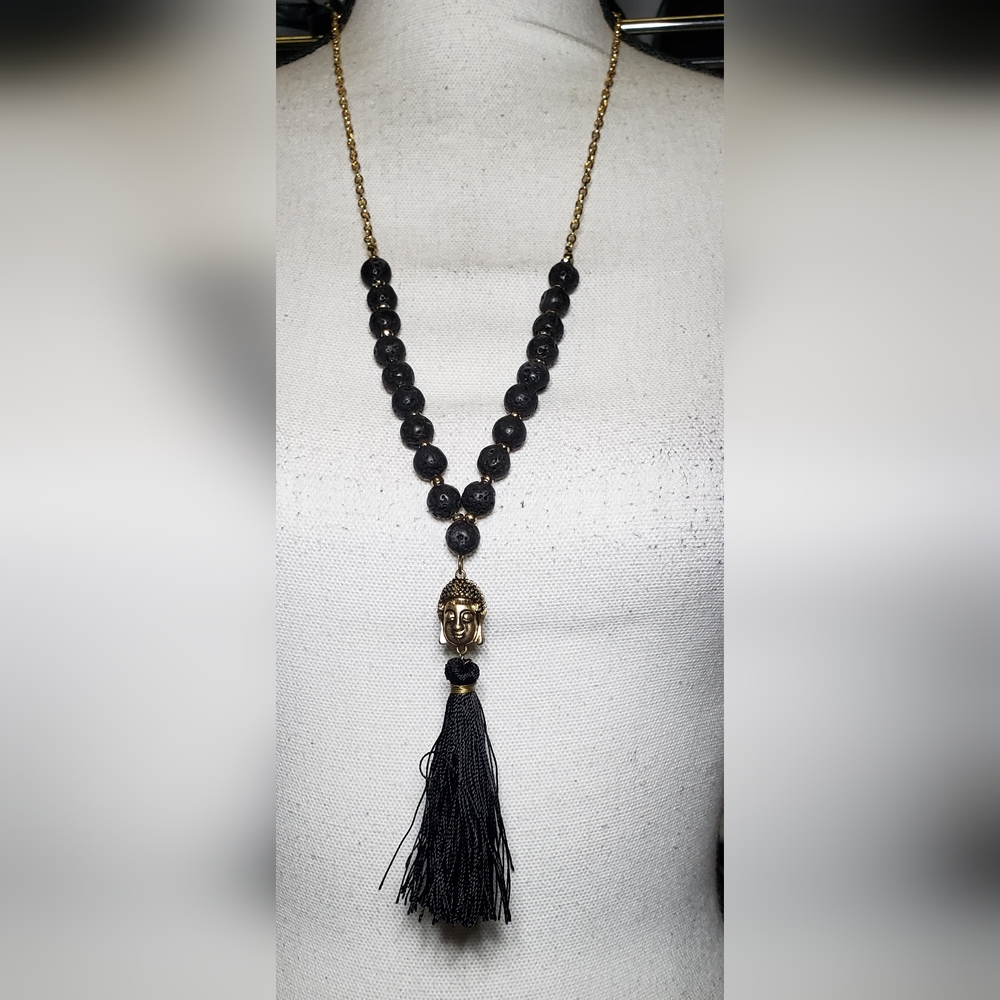 Necklace with a Gold-tone Buddha Pendant and a Black Tassel. 